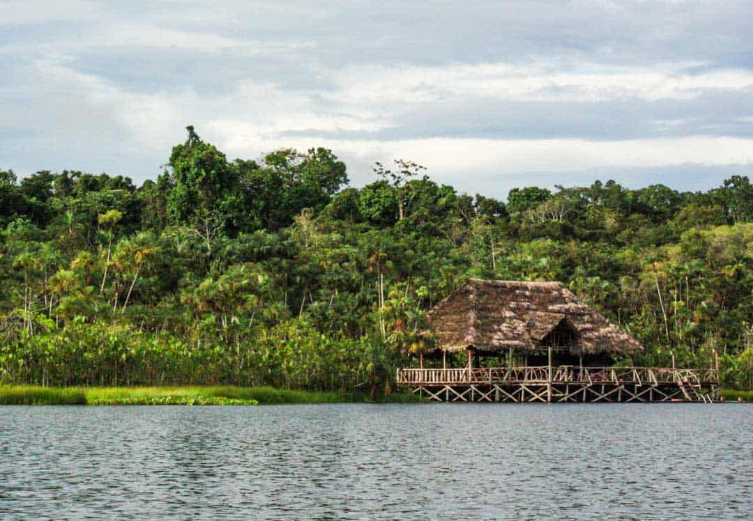 The reed-and-wood arrival building is the only sign an ecolodge hides away in the jungle.