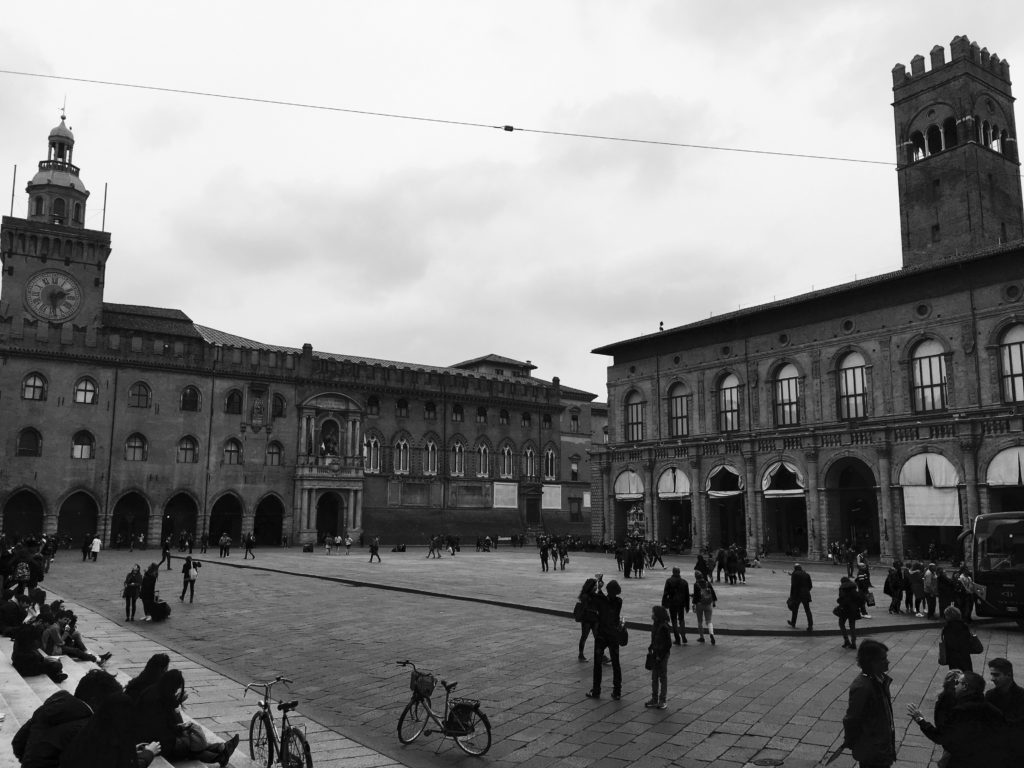 People watching from the steps of Basilica di San Petronio, Bologna, Italy