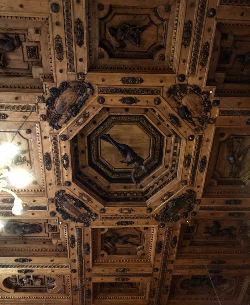 Exquisite carved cedar ceiling of the Teatro Anatomico in Palazzo dell’Archiginnasio, Bologna, Italy