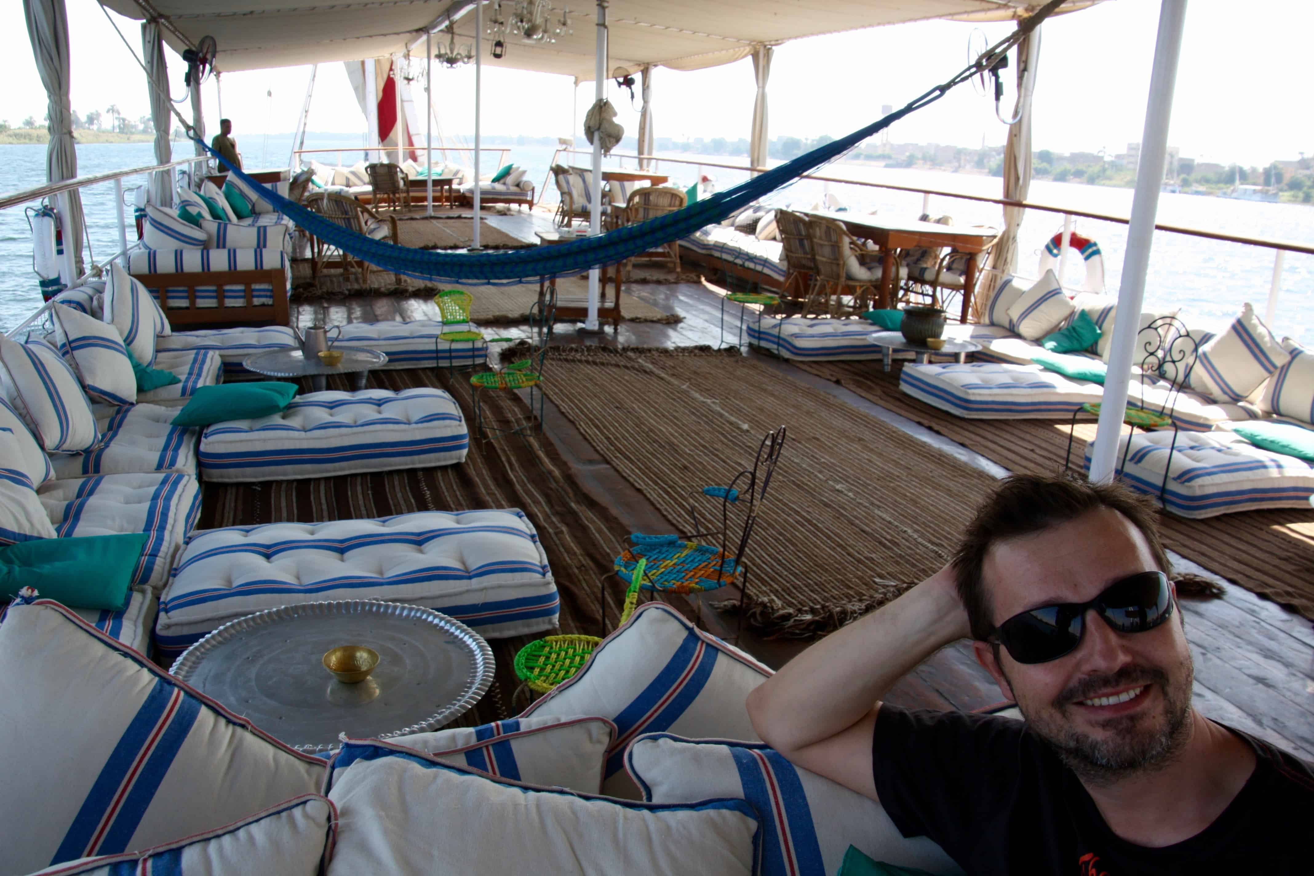 The cushion-strewn top deck of the Assouan, a traditional dahabiya nile cruise.