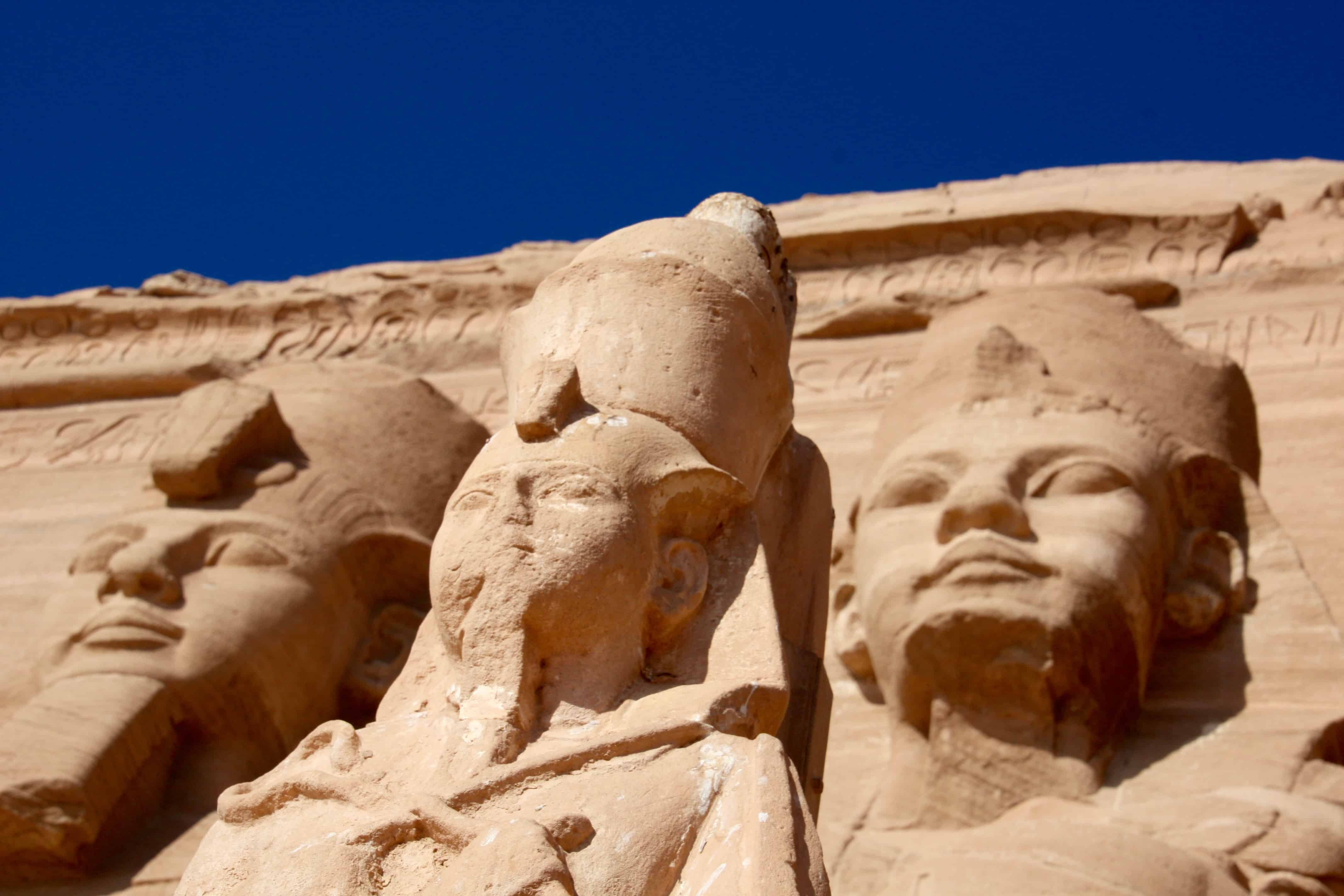 Giant statues of Ramses II and his wife Nefertari at Abu Simbel, Egypt