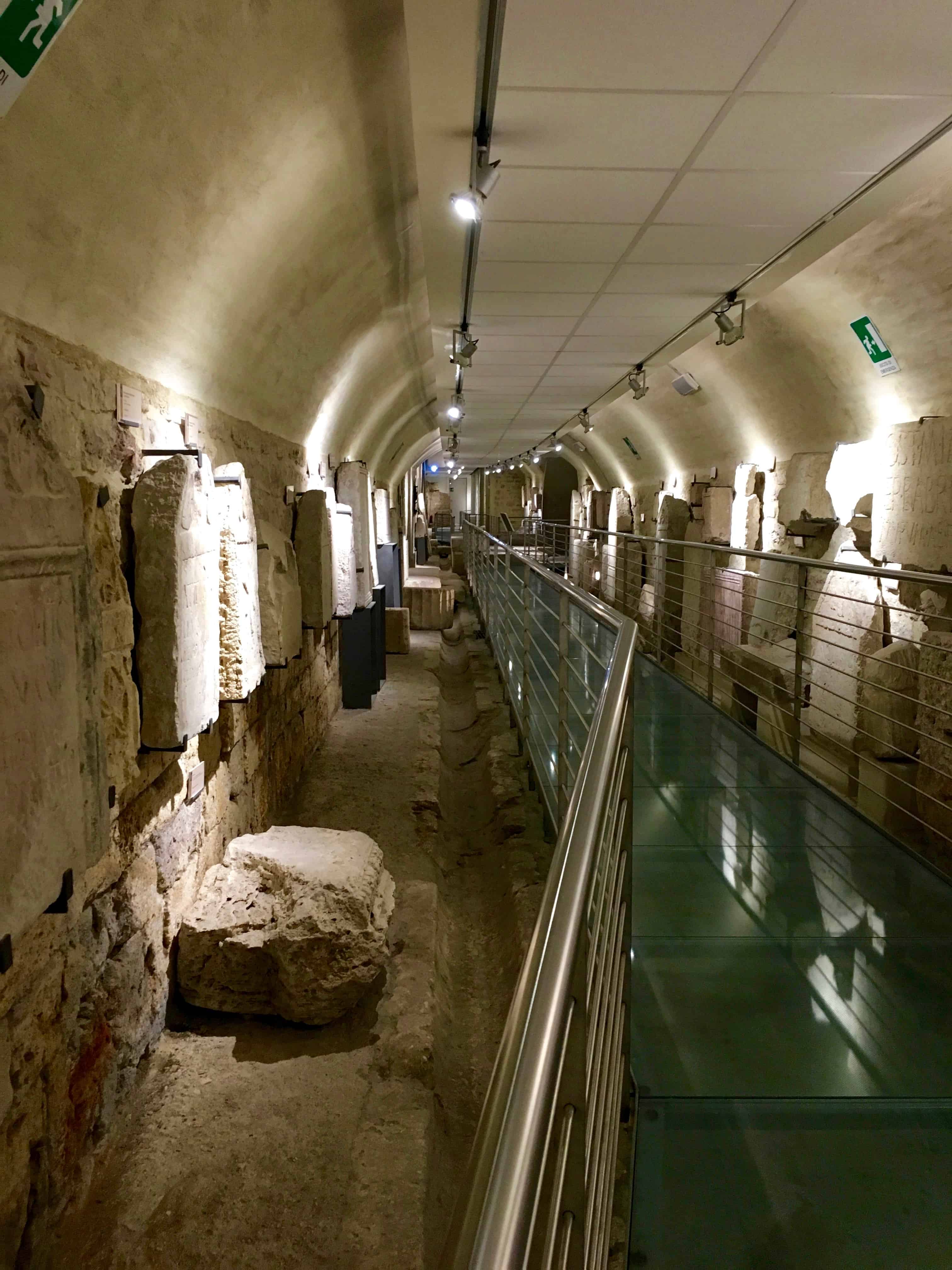 Walk through the ancient forum of Asisium, underneath the modern Piazza del Comune, Assisi