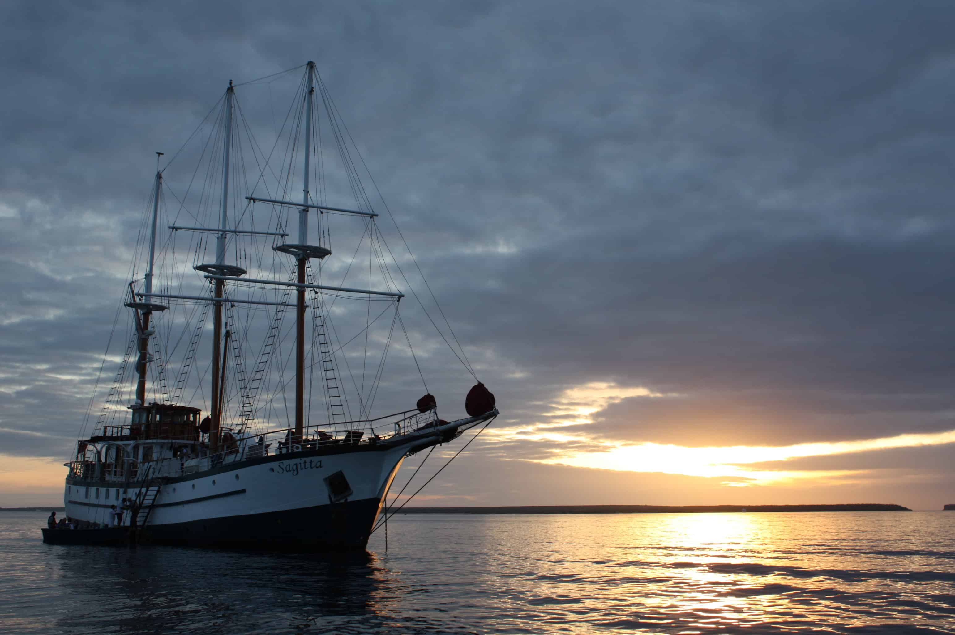 Sailboat Sagitta at dawn in Galapagos Islands