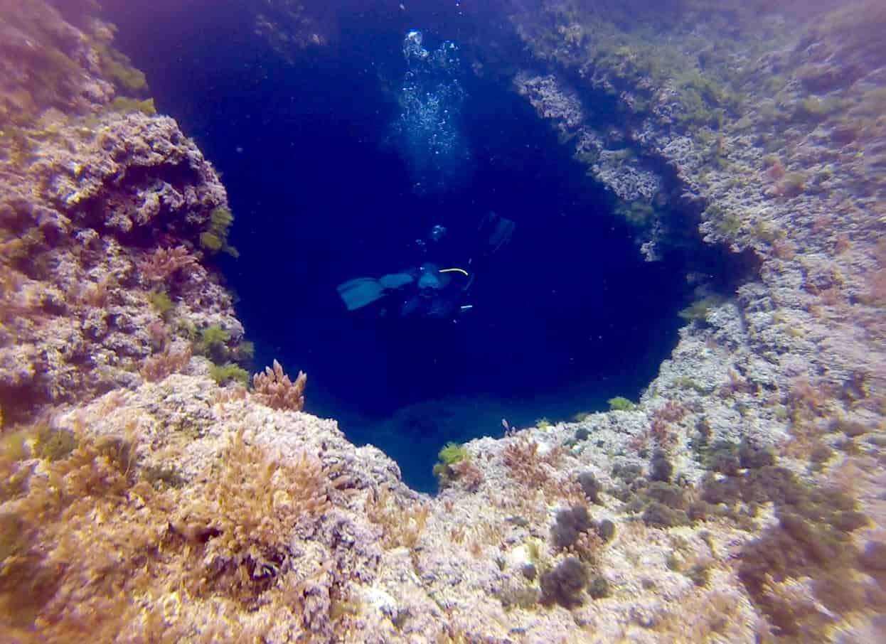 Diving in the Xlendi Bay tunnel, Gozo, Malta