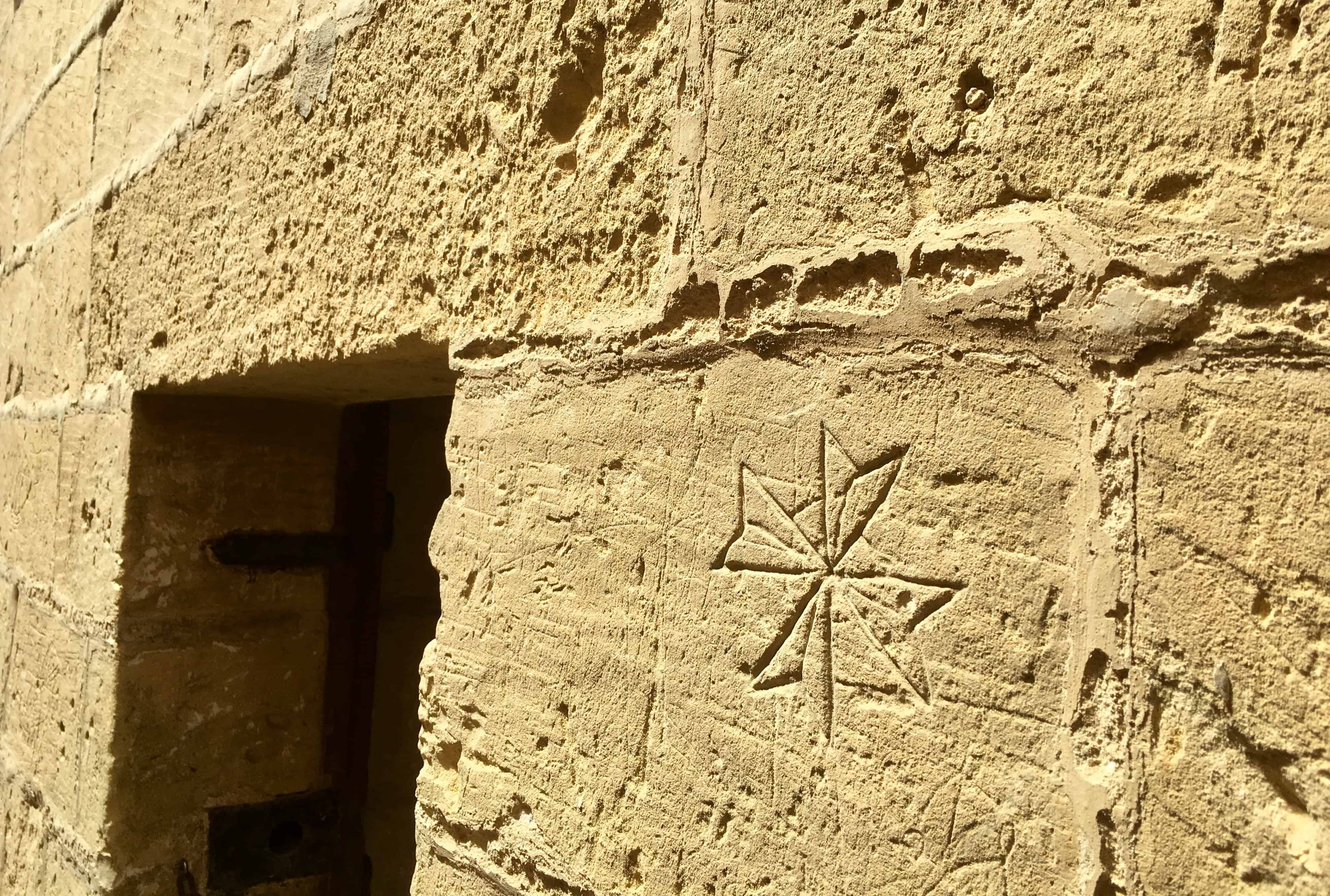 Graffiti of a Maltese Cross in the Old Prison, Citadella, Gozo
