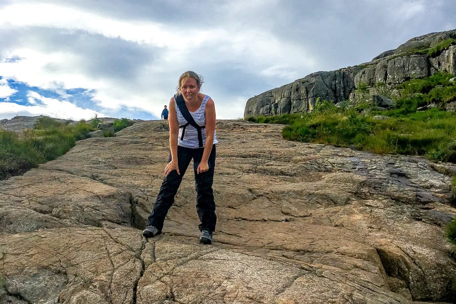 A hiker takes a breather on a steep section of hiking trail – a reminder the Pulpit Rock hike can certainly be challenging.
