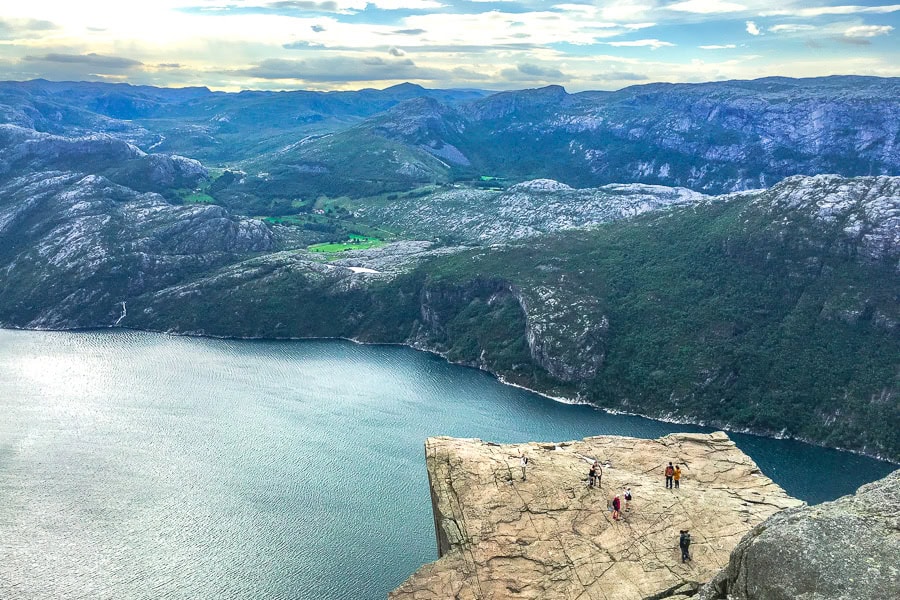 Views from above Preikestolen and Lysefjord on a dramatically cloudy day hiking Pulpit Rock.