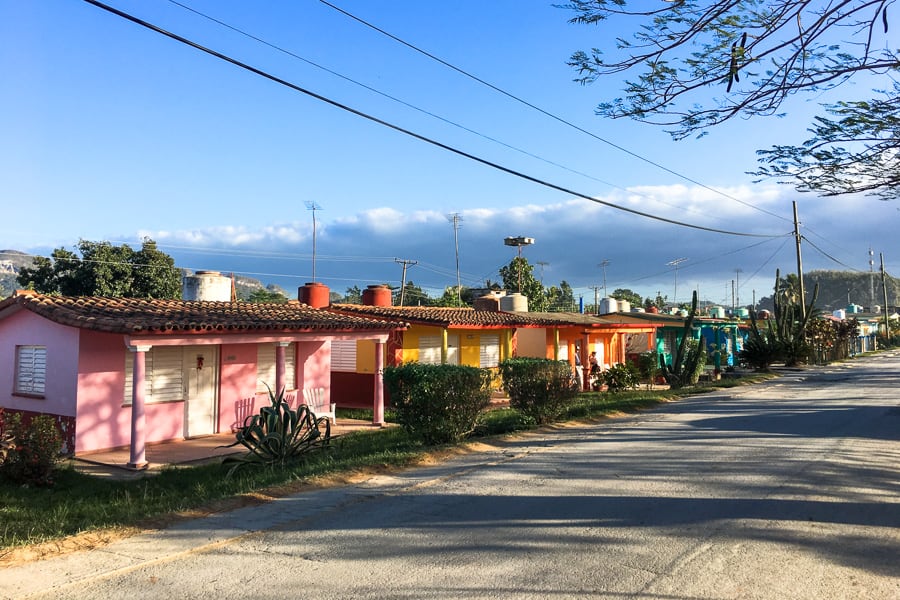 Accommodation in Cuba: Colourful houses line a street in Vinales. 