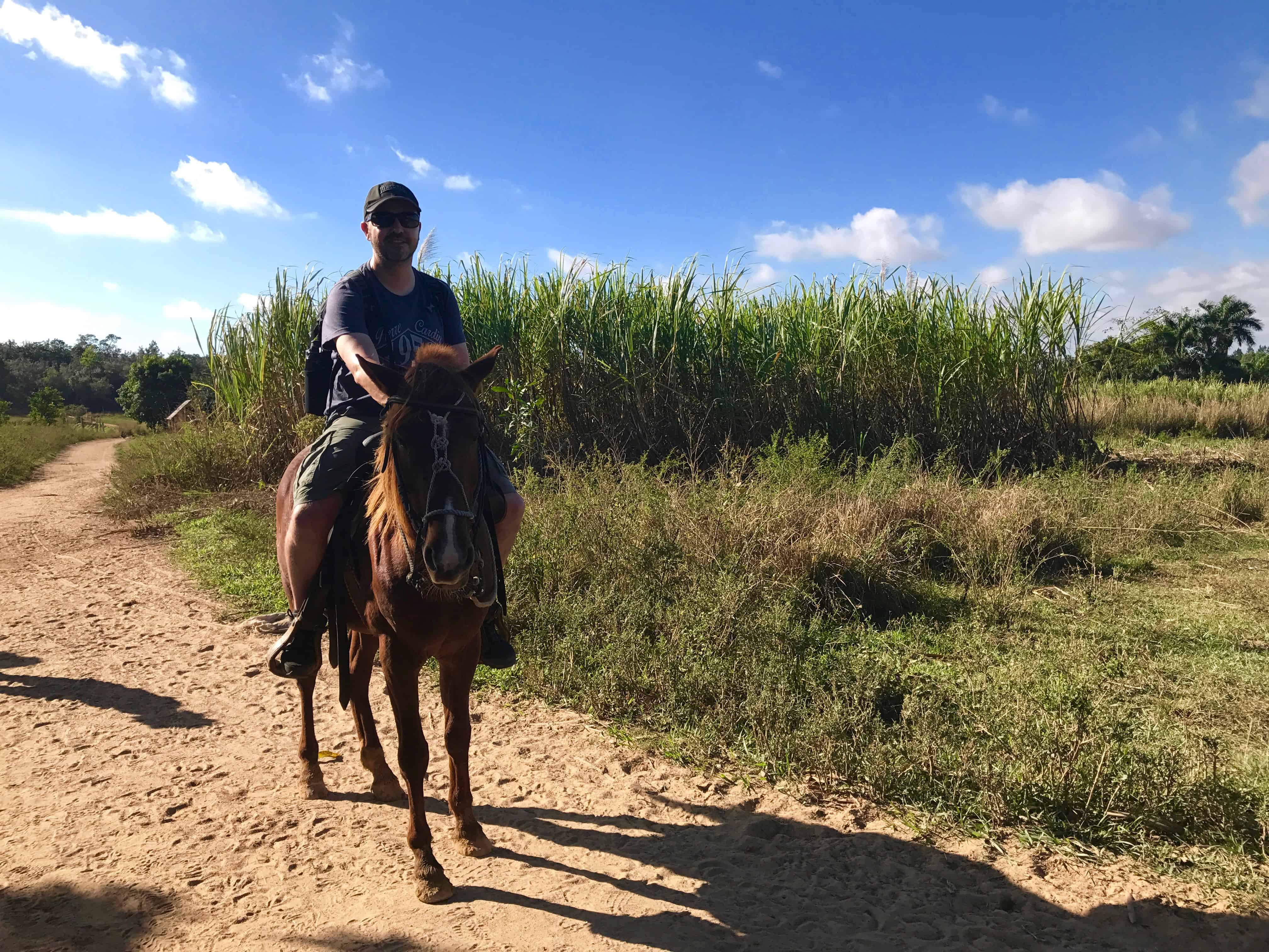 John riding a horse in Viñales