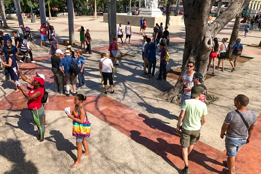 People gather in a public park to access wifi in Cuba.
