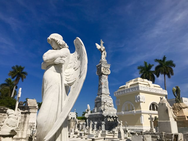 At Havana's largest cemetery, the Necrópolis Cristóbal Colón, statues of angels rise above the tombs and mausoleums.