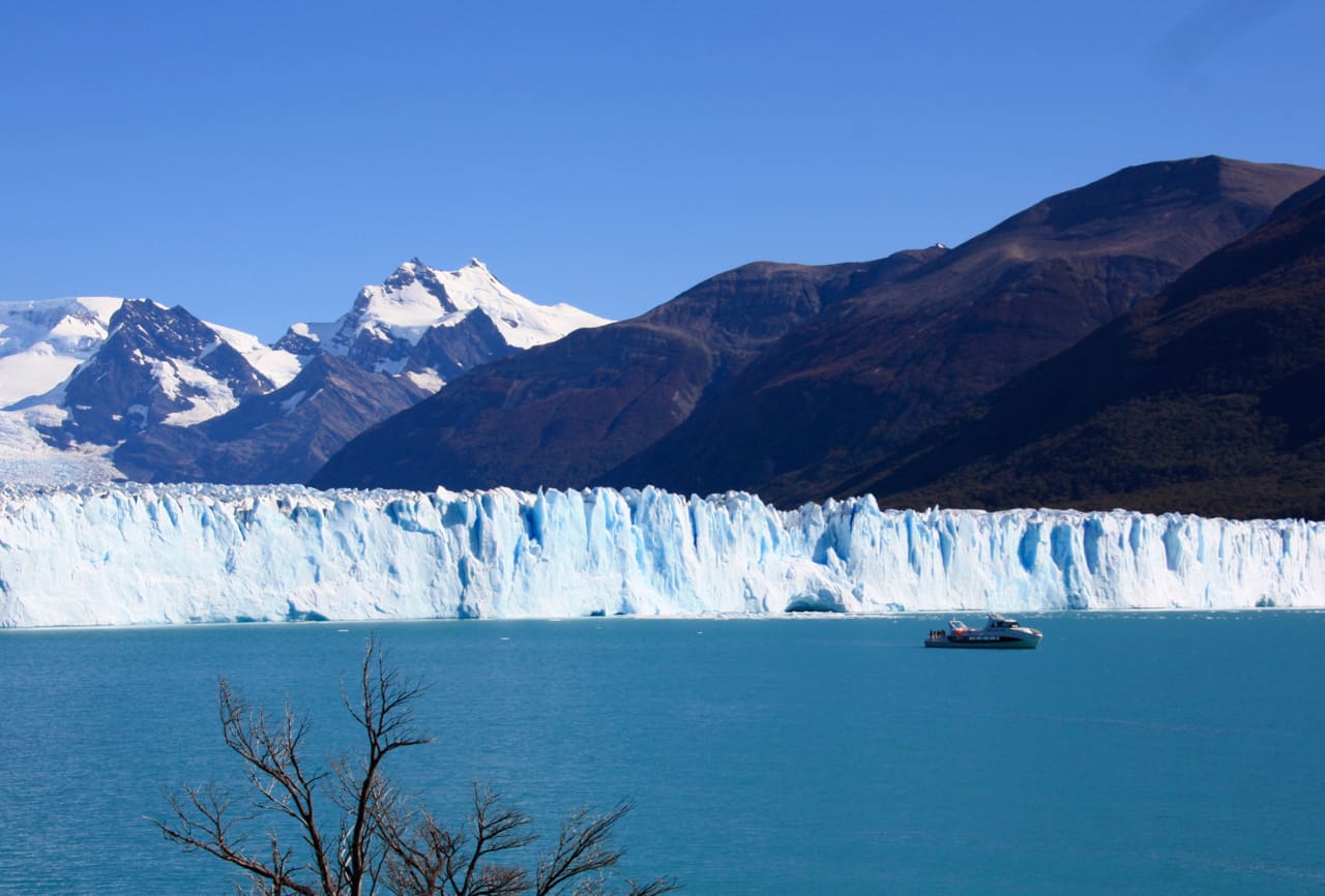 A boat approaches the north face of Perito Moreno Glacier.