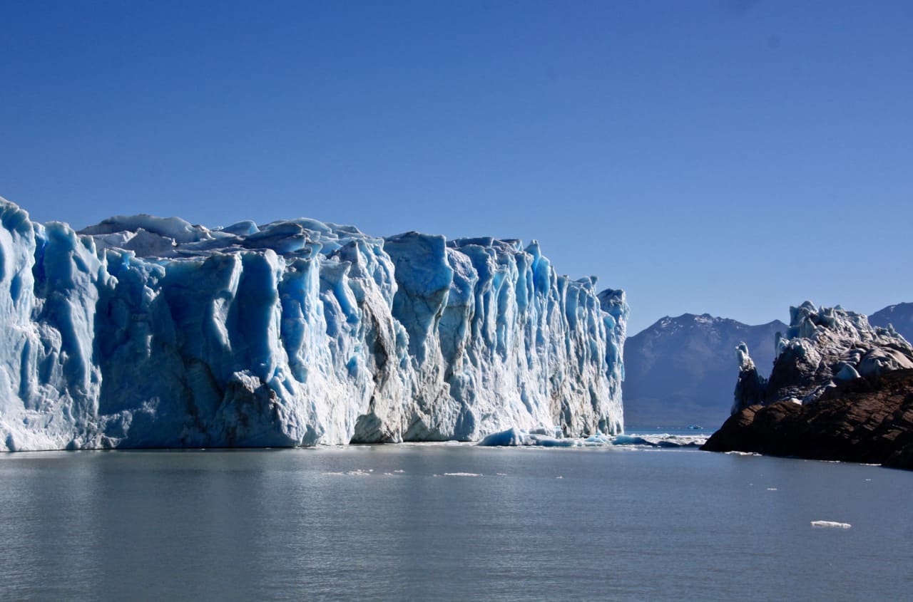 View of the towering south face of Perito Moreno Glacier from a boat.