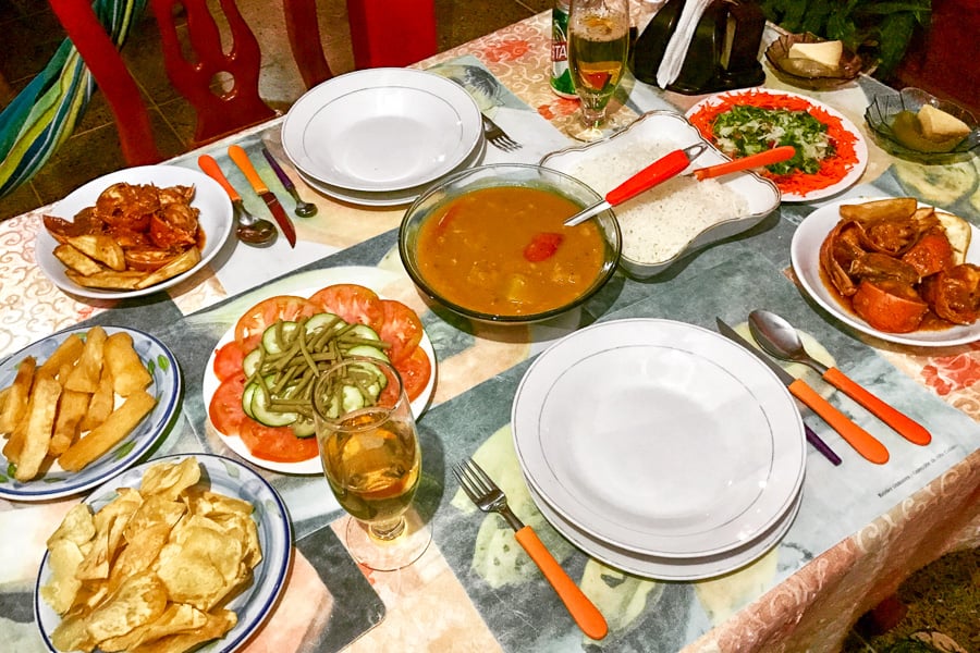 Table set with different local dishes on a trip to Cuba.