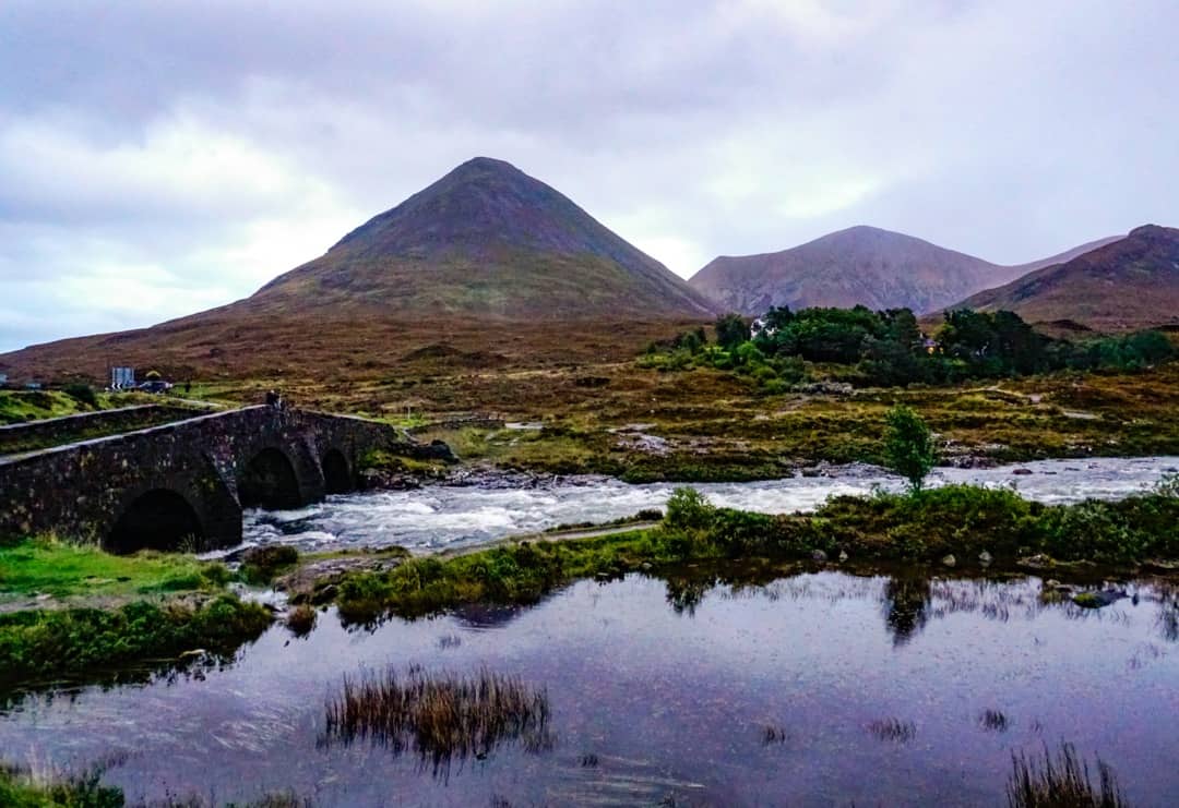 Sligachan Bridge rests in the foreground of the Cuillin Mountains.