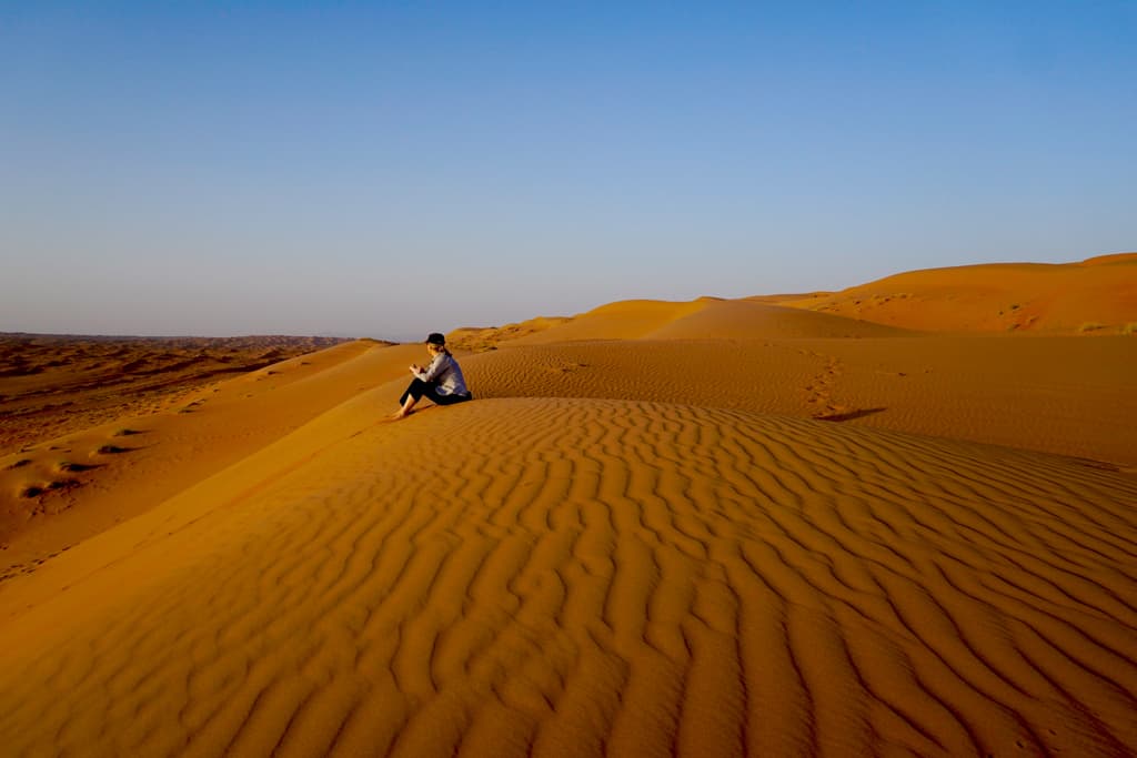 Oman pics – The burnt orange suns of Sharqiyah Sands at sunset are a perfect place to sit quietly and contemplate the world around you.