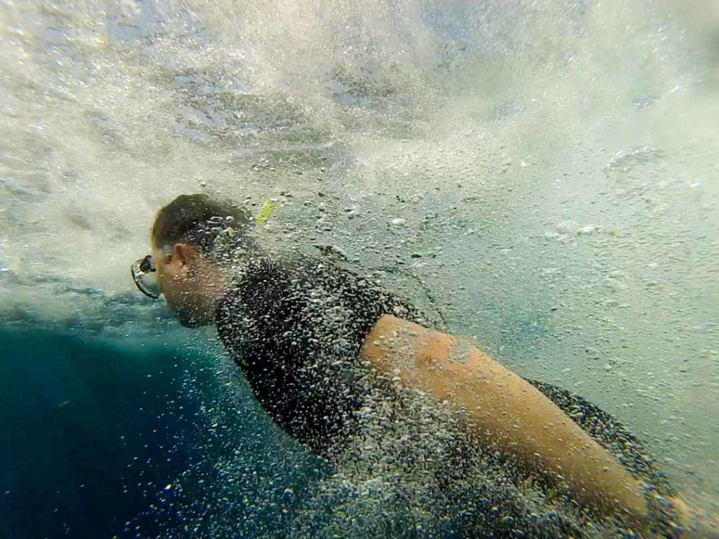 John drops beneath the surface on a whale shark tour.