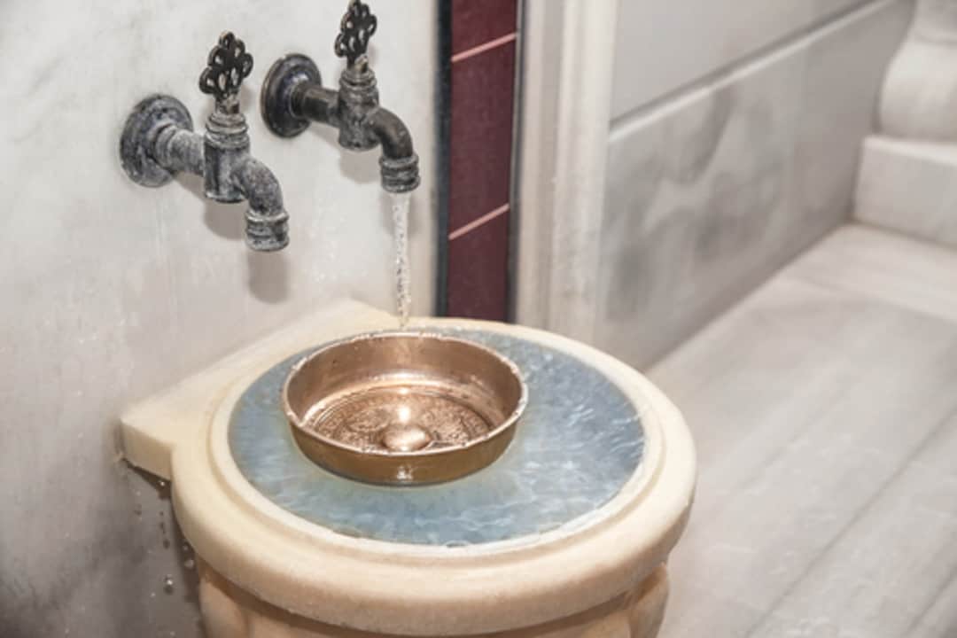 Turkish bath etiquette begins with a personal wash by the basin in the main hammam. ©Chernetskaya|Dreamstime.com