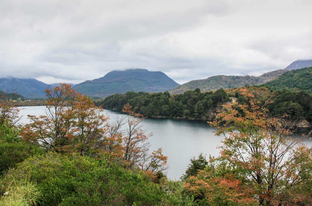 Lake Machonico on the 7 Lakes Route is surrounded by colour in the Fall.