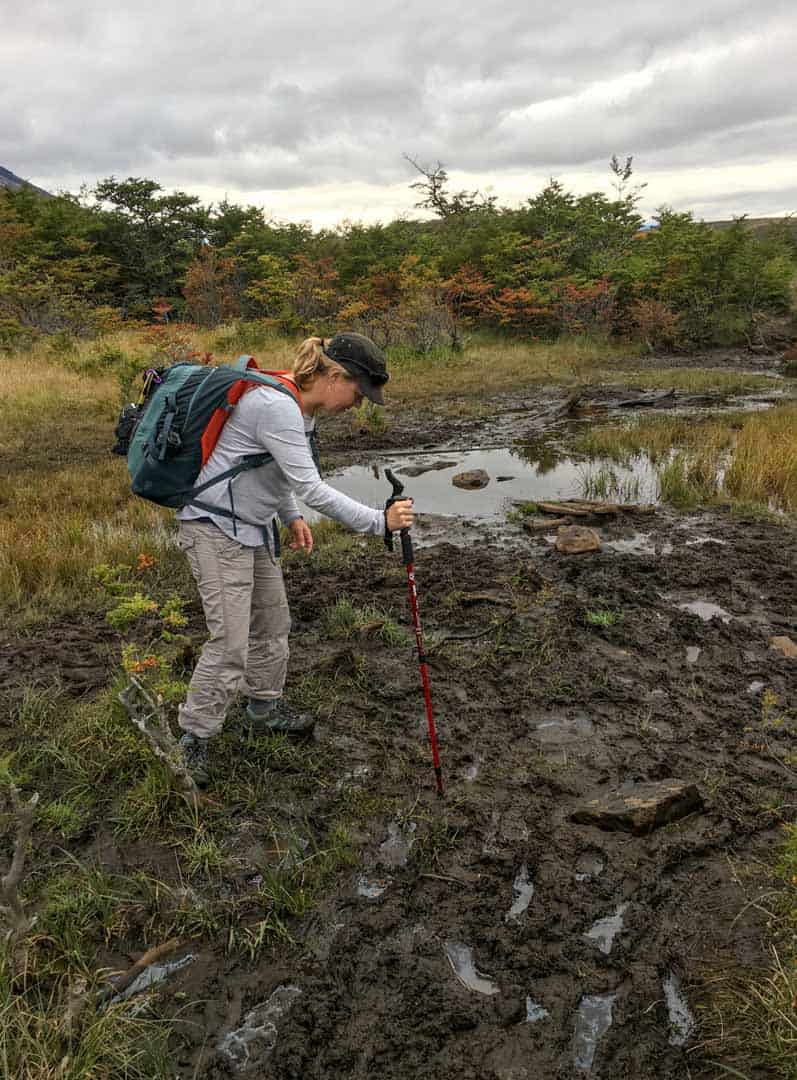 Navigating through mud is common when hiking Torres del Paine.