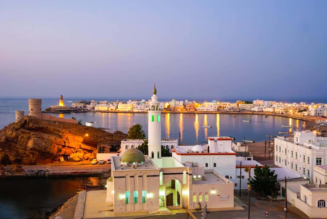 Twilight views over the city of Sur is a highlight of any Oman itinerary.