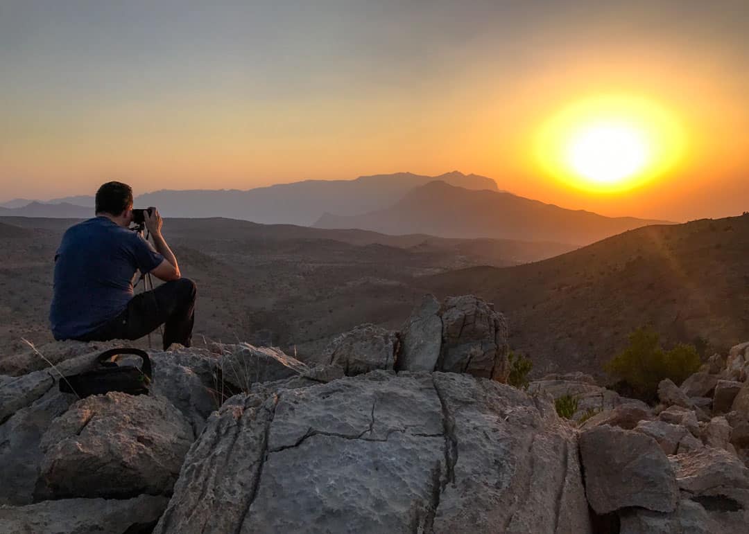 Enjoying a stunning sunset panorama over the peaks of Jebel Shams is definitely one of our highlights of Oman.