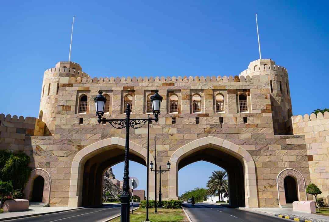 Muscat Gate marks the ancient entrance to Oman's capital, a well trodden path on any Oman Roadtrip.