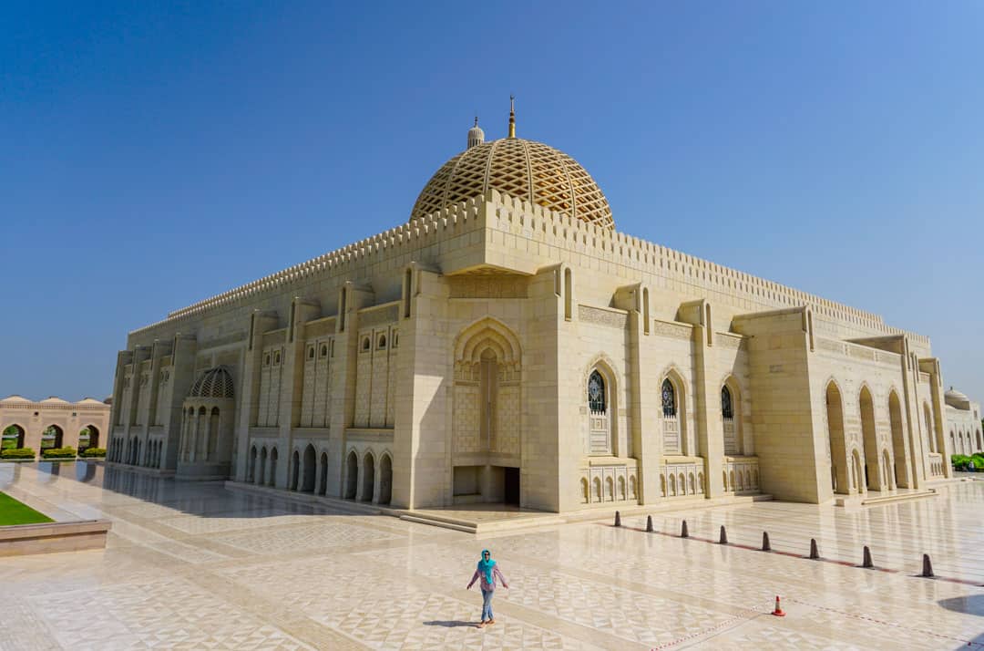 The vast and beautiful Sultan Qaboos Mosque in Muscat is one of the most calm and serene places to see in Oman.