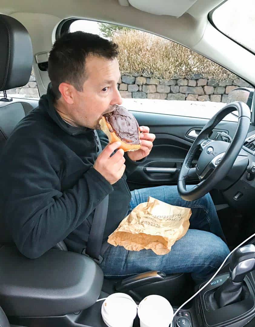 Eating a chocolate-covered Snúðar from Geirabakari Bakery.