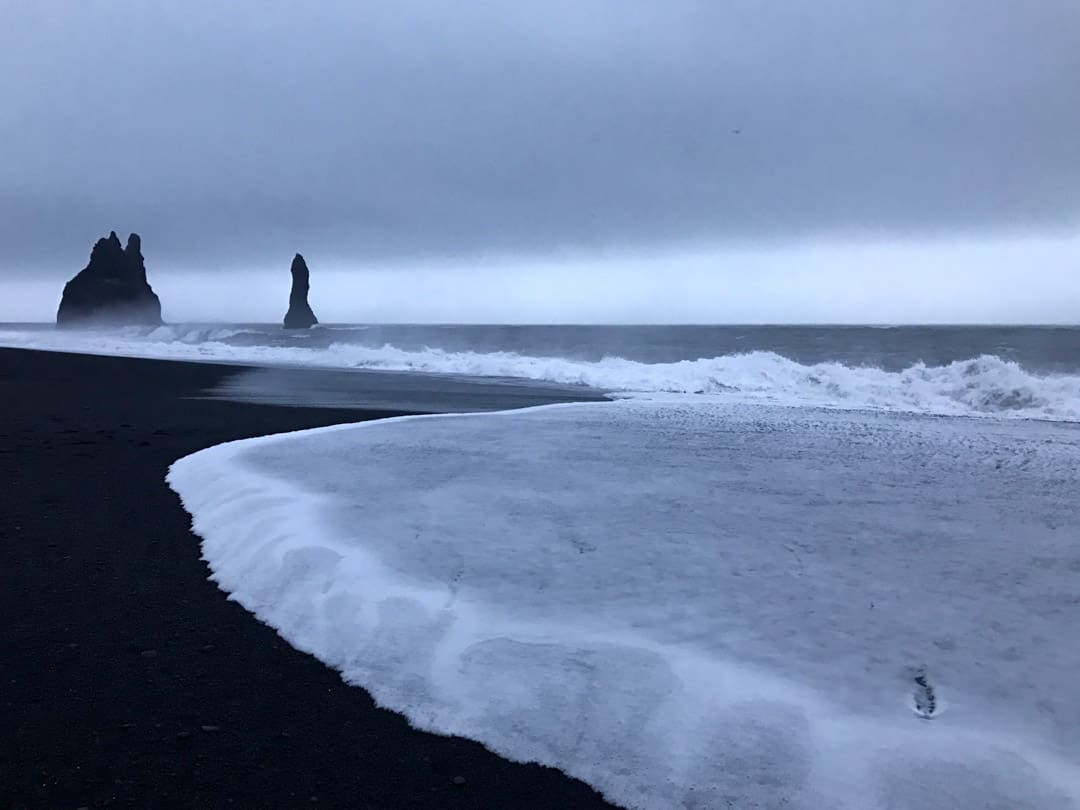 Be sure to add the black beach of Reynisfjara to your winter Iceland itinerary