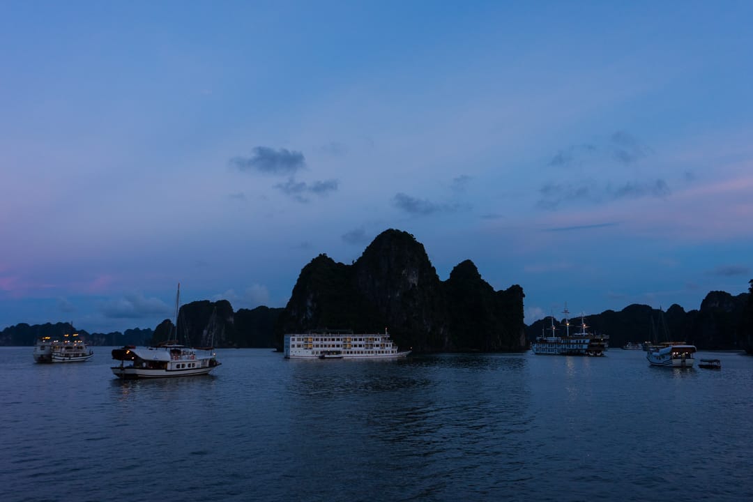 Halong Bay Boat Cruises Gather At Night For Safety.