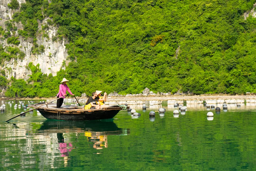 A Traditional Bamboo Boat Ride Is A Popular Thing To Do In Halong Bay.