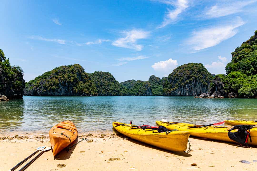 Kayaks Pulled Up On A Bai Tu Long Halong Bay Beach.