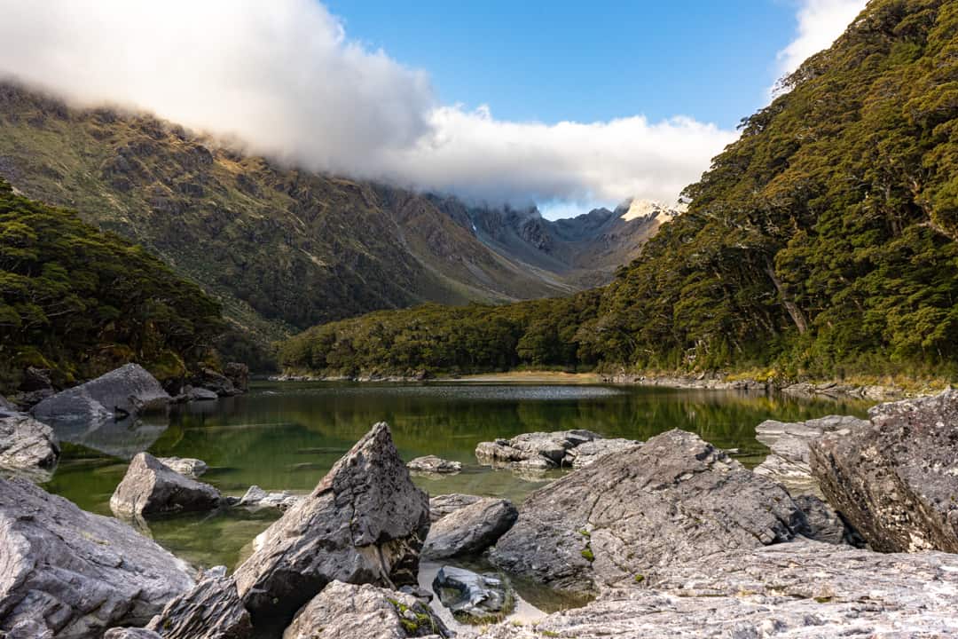 Boulders Scatter The Edge Of Lake Mackenzie Trek NZ