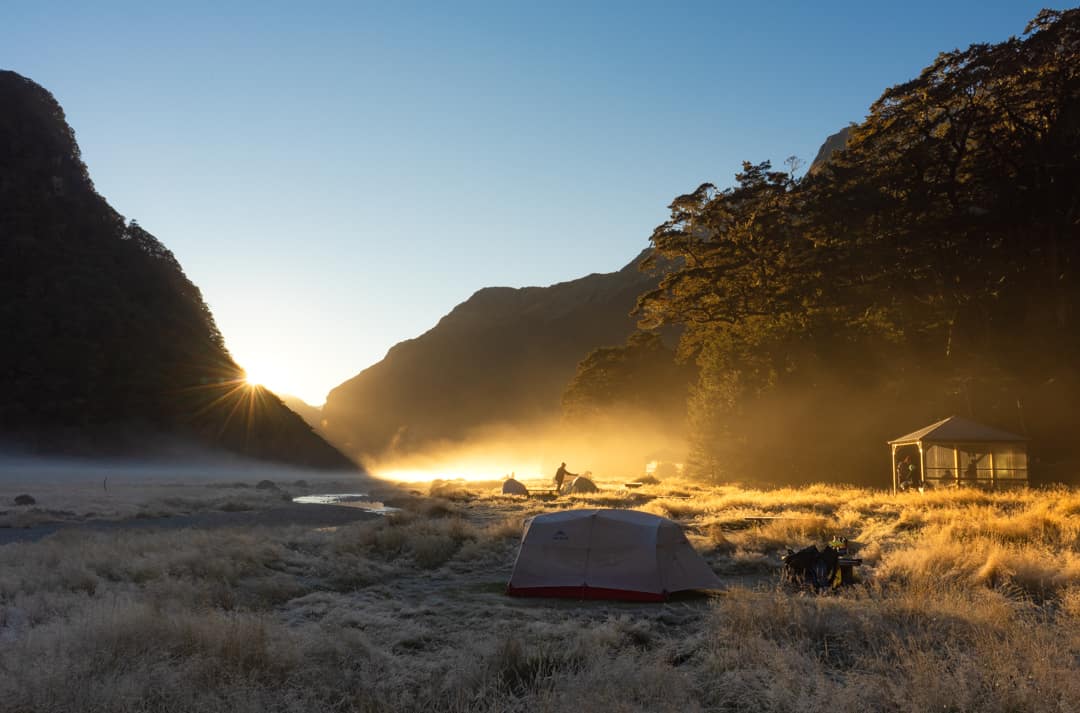 Sunrise Over Routeburn Flats Camping Ground In Mount Aspiring National Park, New Zealand.
