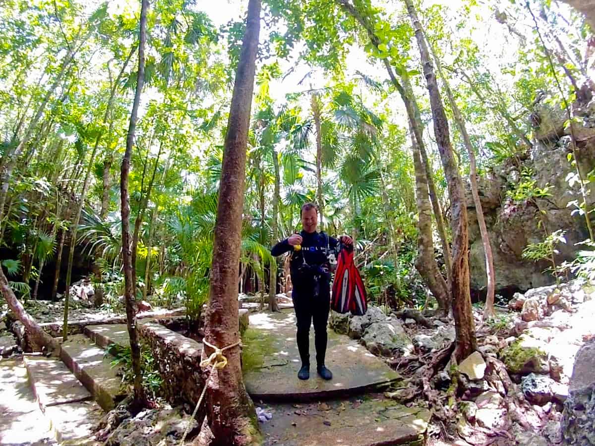 Geared up for a dive in the jungle at Tajma Ha Cenote Mexico.