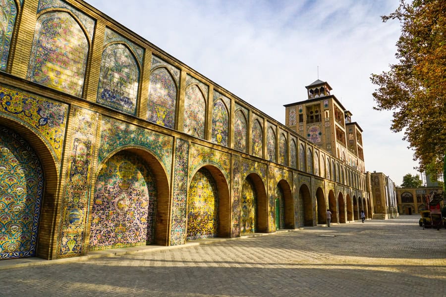 Late afternoon sun shines on the tiled walls at Golestan Palace – one of the top things to do in Tehran.