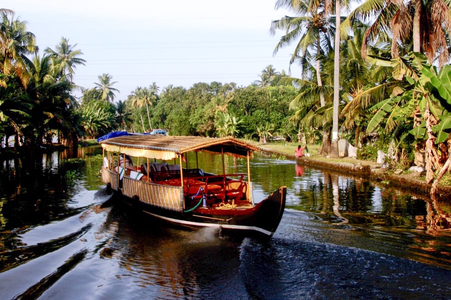A traditional houseboat will take you to some of the most beautiful places in Kerala.