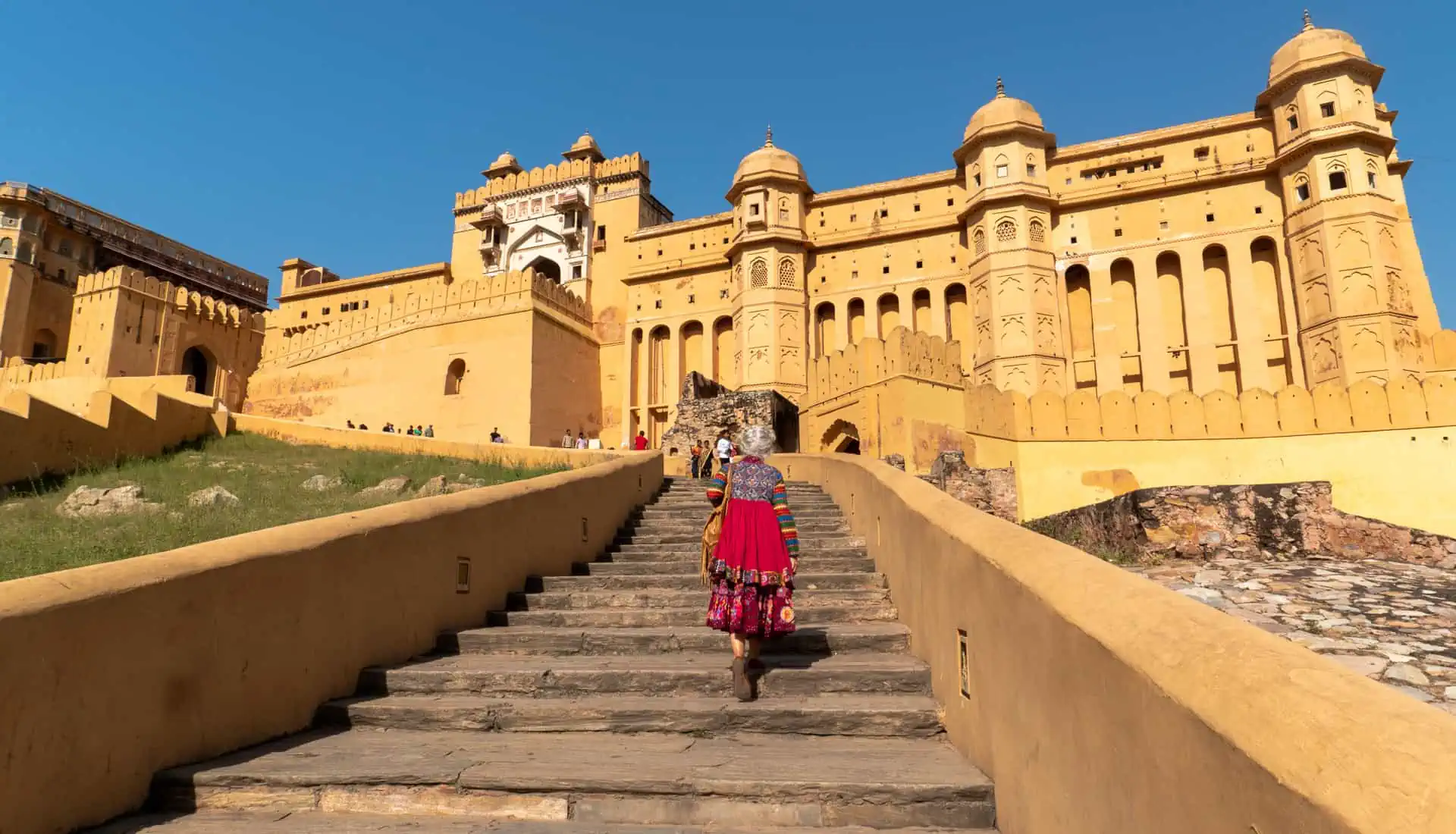 The imposing stairway to Amber Fort, one of the highlights of a Rajasthan road trip in India.