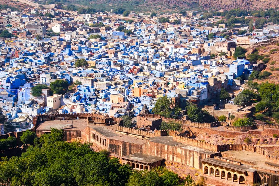 Views over the ramparts of Mehrangarh Fort and the blue city of Jodhpur, a highlight of any Rajasthan itinerary.