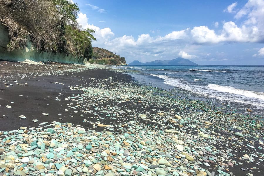 The famed bluestone beach in Flores with what’s left of the blue stones – one of more poignant stops on our Flores Itinerary.