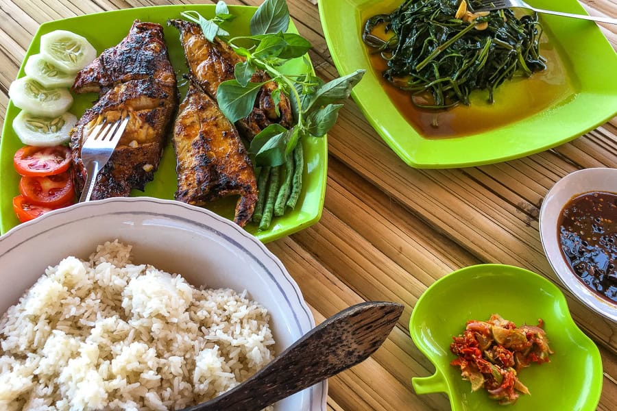 A delicious seafood barbecue with grilled fish, veg, sauces and rice – enjoyed during our Flores travels.