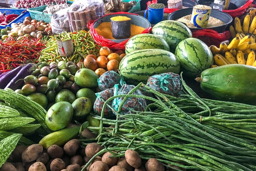 An abundance of colourful fruit and veg at Bajawa market on our Flores tour.