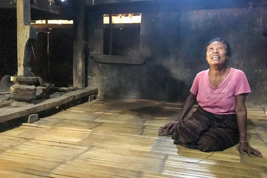 A local of Djopu village in a house bathed in light – meeting the irrepressible Mama Maria was a highlight of our Flores trip