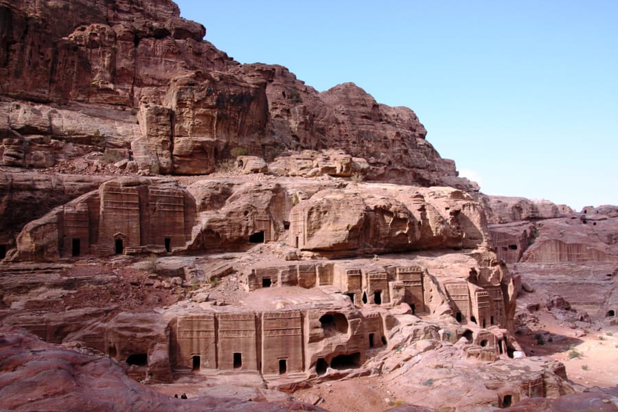 Carved tombs mark the rock face in ancient Petra, one of the world's best adventures.