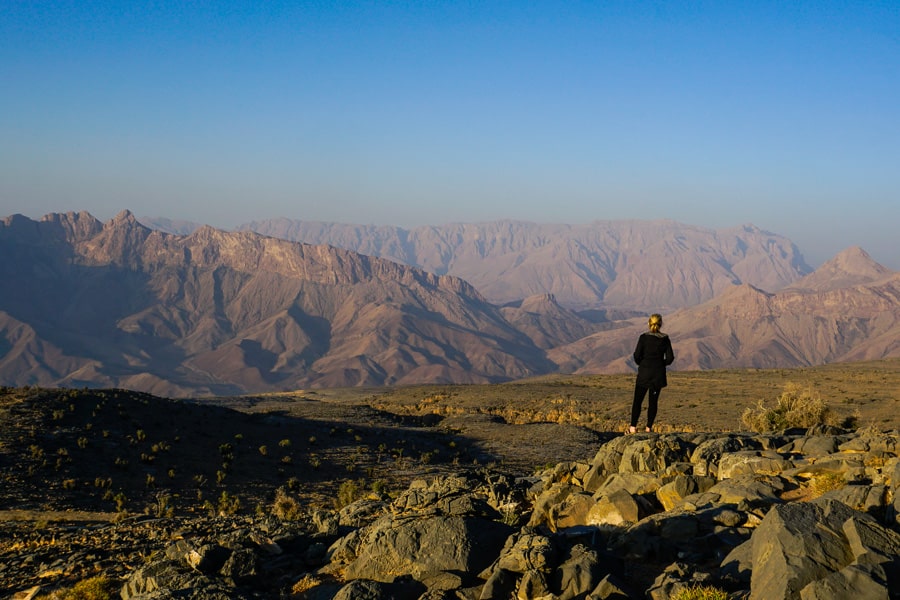 Dan looks out over the rugged mountains of Jebel Shams at sunset.