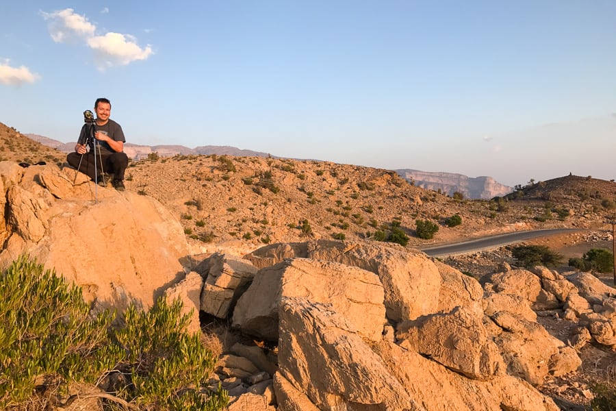 Epic Road Trip Oman: Golden rocks at sunset atop Jebel Shams.
