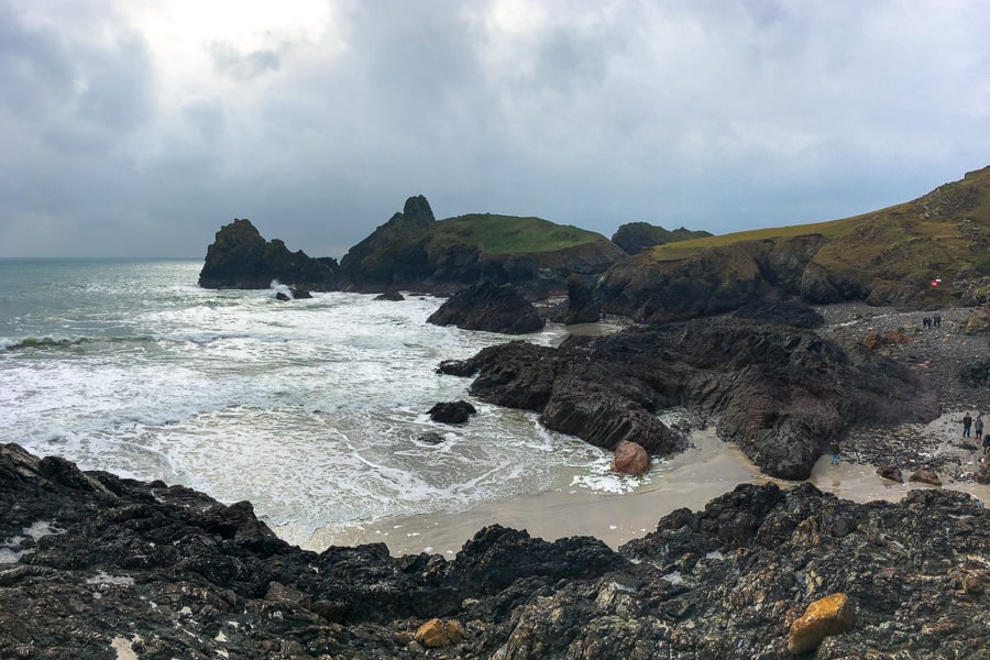 Places to visit in south west England: Dark clouds over rocky Kynance Cove on The Lizard.