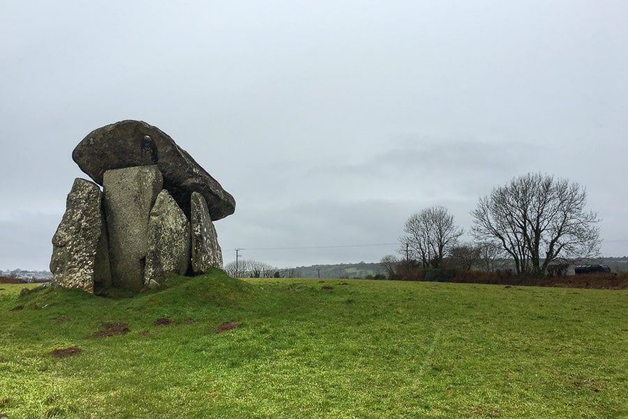 UK road trip planner: The ancient  Trevethy Quoit dolmen stands in a green field. 
