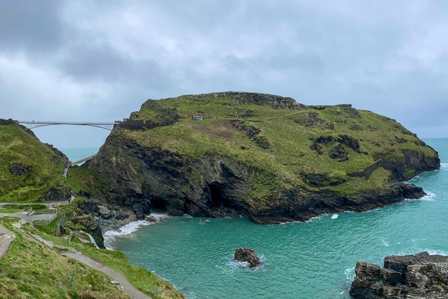 A high bridge links the mainland to Tintagel island.